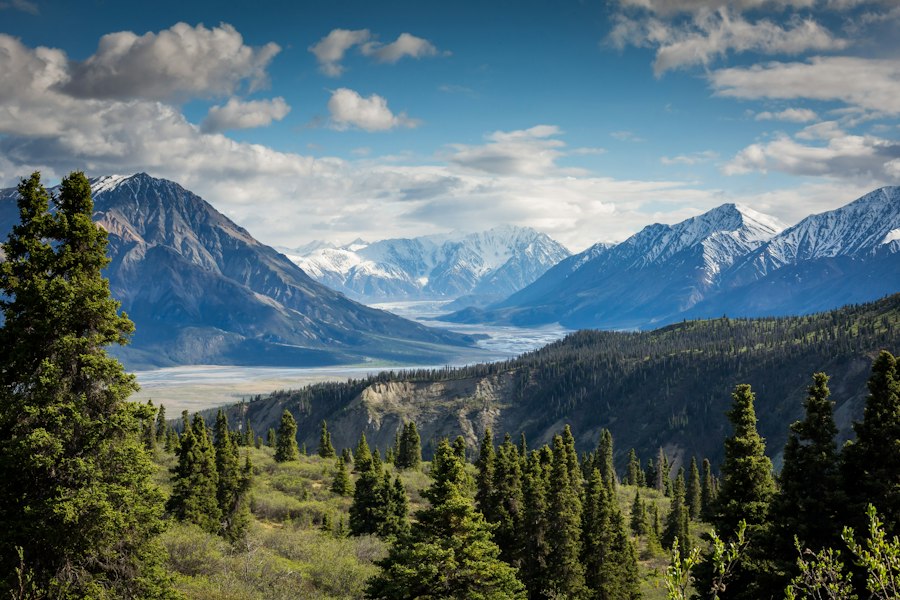 Mountain peaks beneath a soft open sky